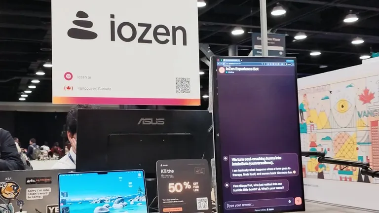 ioZen stand at Web Summit Vancouver showing the Experience Bot running on a vertical monitor